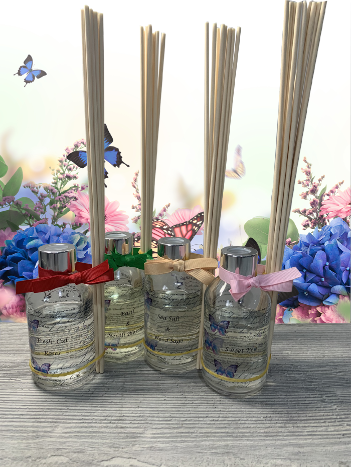 Four bottles of scented reed diffusers.