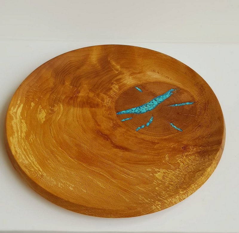 Wooden serving plate with turquoise inlay.