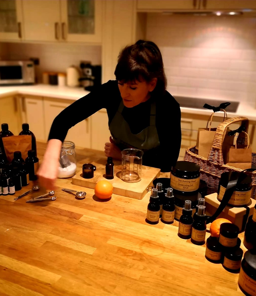 Woman making homemade skincare products.