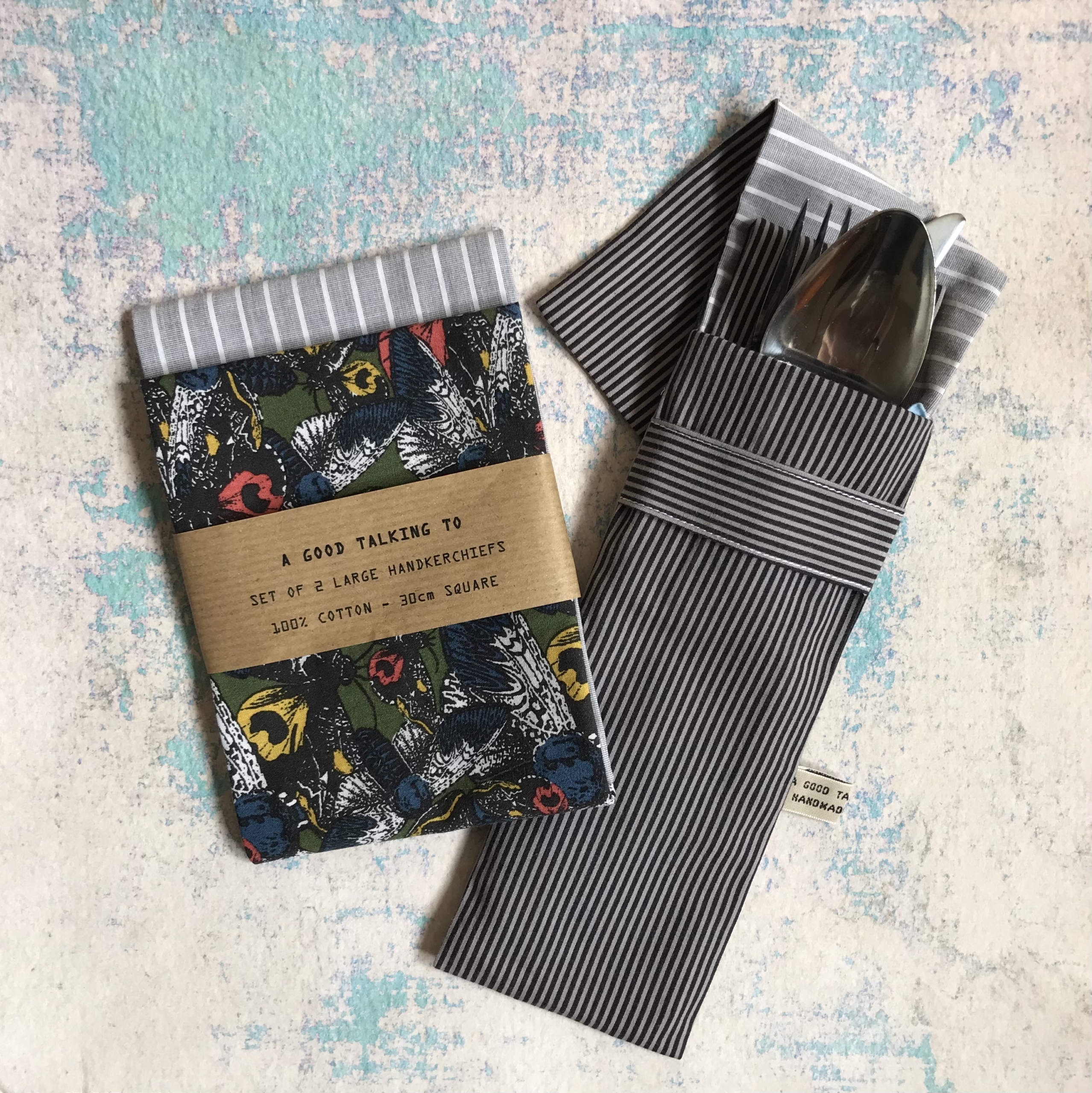 Two striped handkerchiefs and cutlery holder.