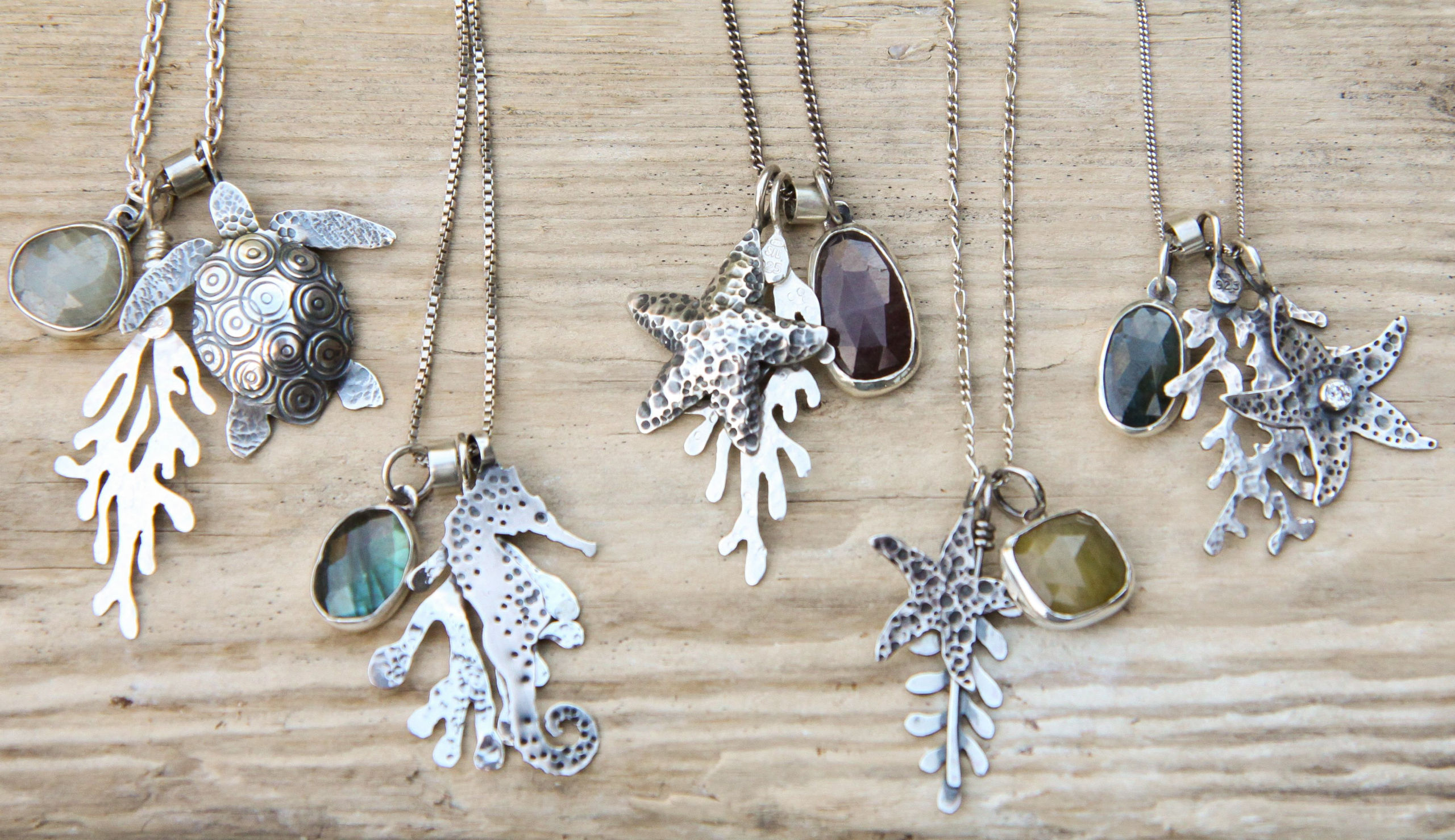 Silver sea life charm necklaces with stones.
