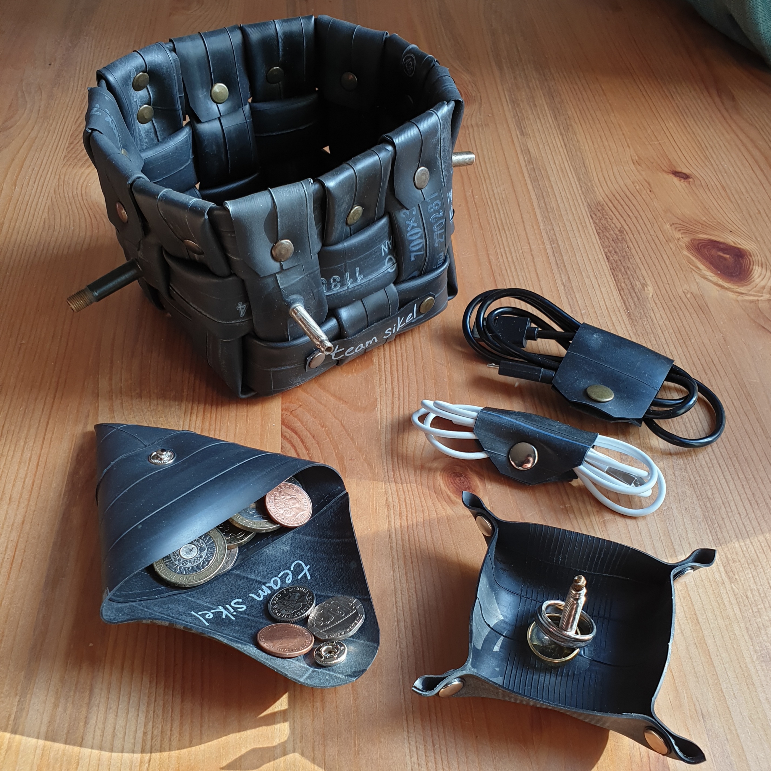 Recycled tire crafts on a wooden surface.