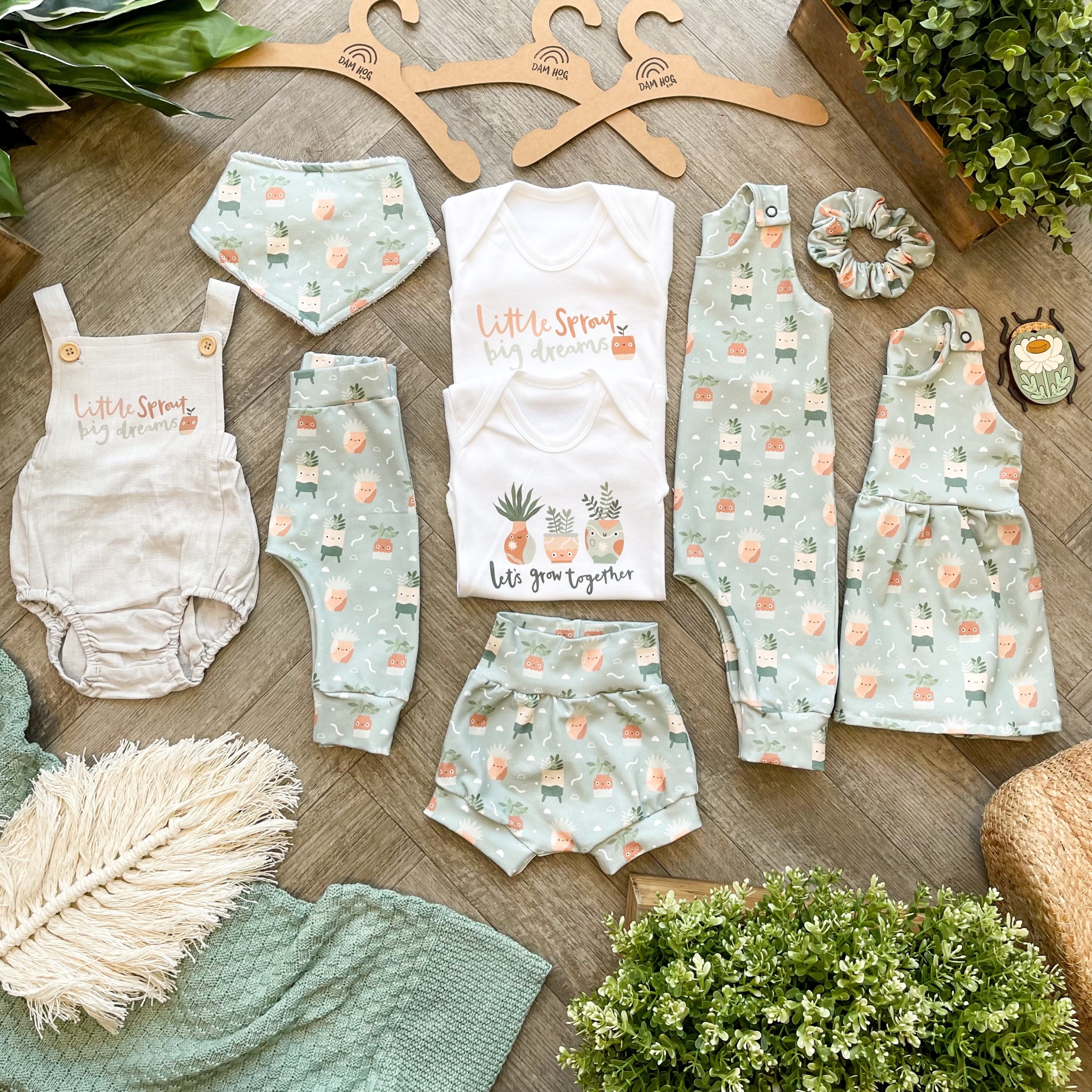 Baby clothes with plant pot design.