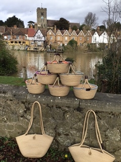 Woven baskets on a stone wall.